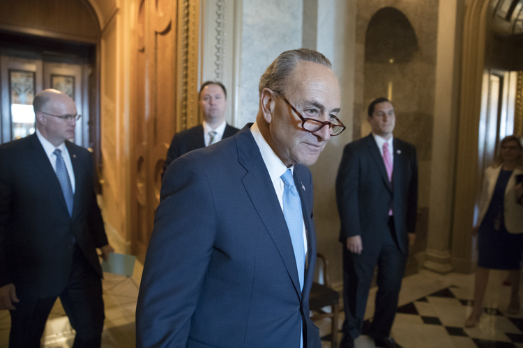 Chuck Schumer&nbsp;enters a meeting of Senate Democrats to discuss the response to Comey being fired. (J. Scott Applewhite/AP)</p>  