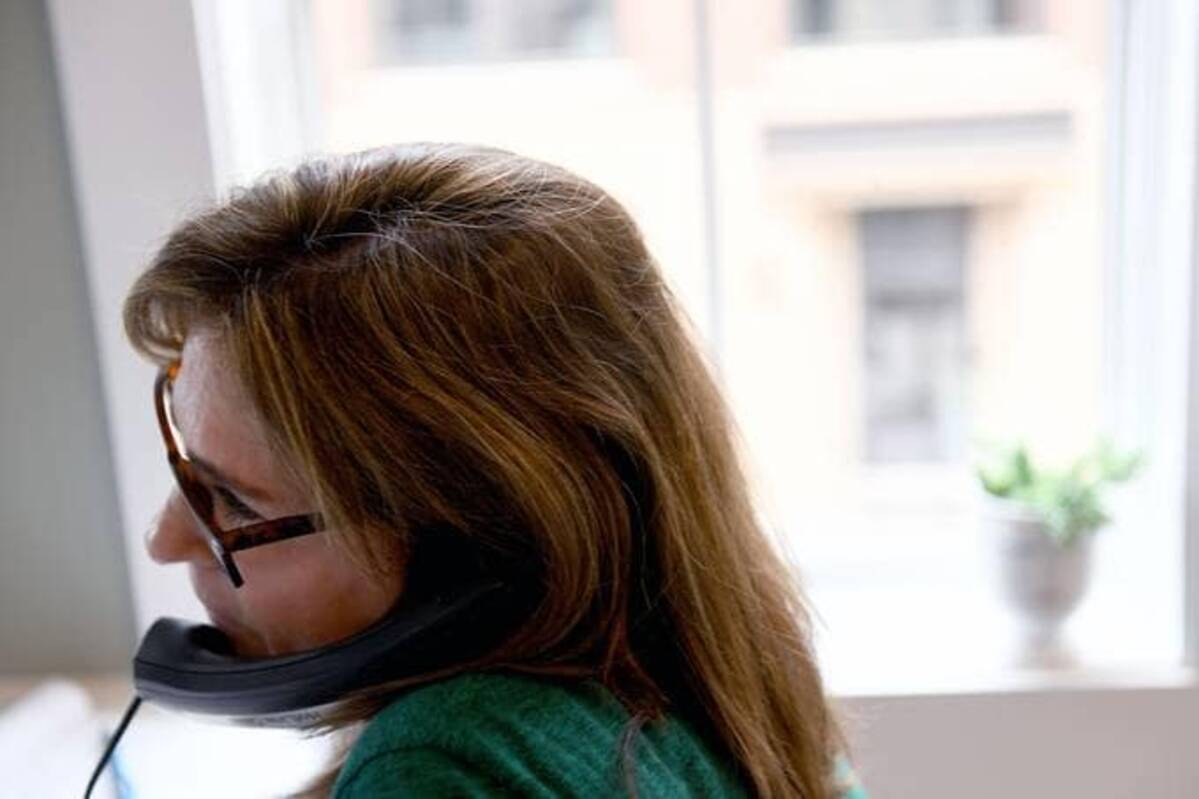 A worker monitoring the Montgomery County Hotline including from the National Suicide Prevention Lifeline. (Photo by Katherine Frey/The Washington Post)
