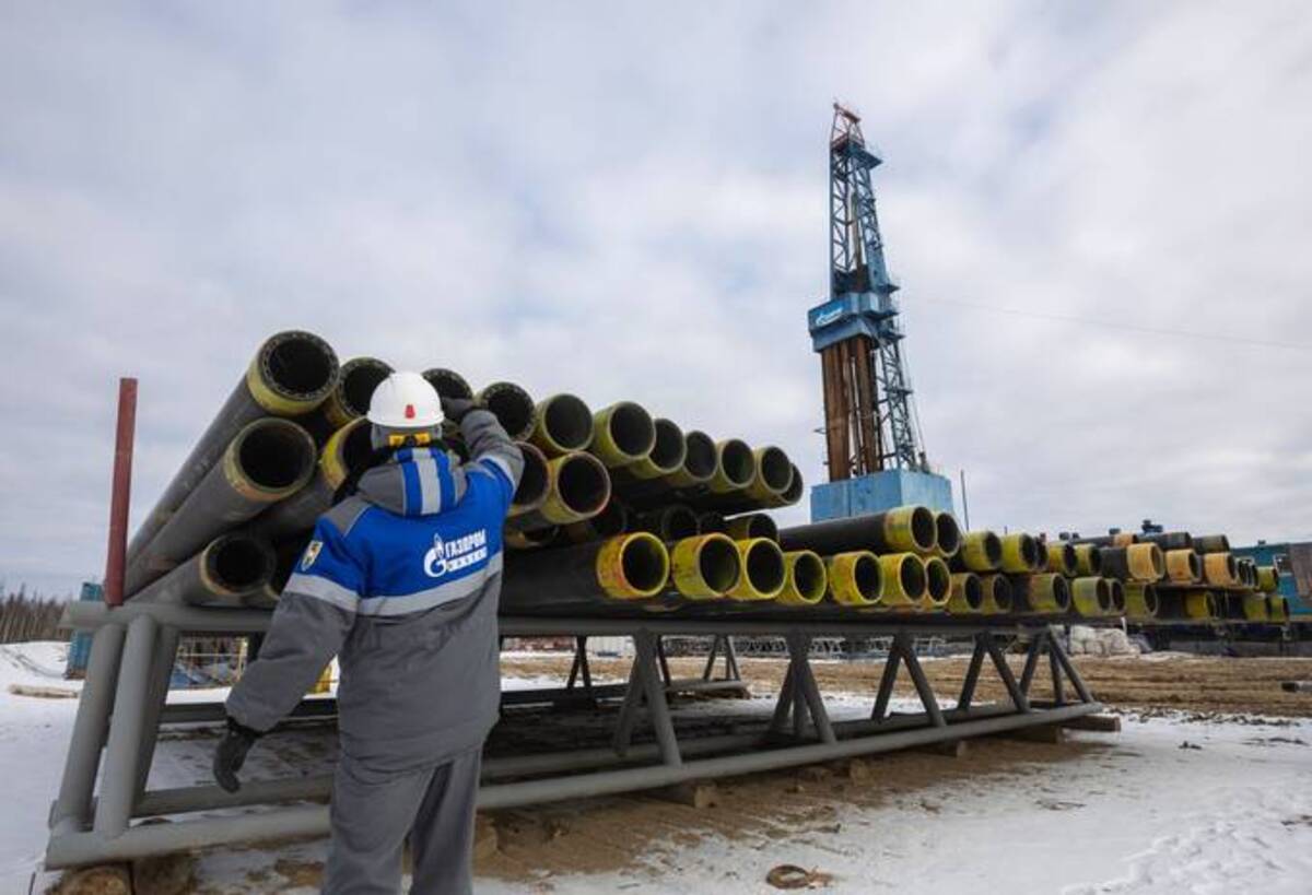 A worker inspects pipes at a gas drilling rig in Russia. (Andrey Rudakov/Bloomberg News)&nbsp;