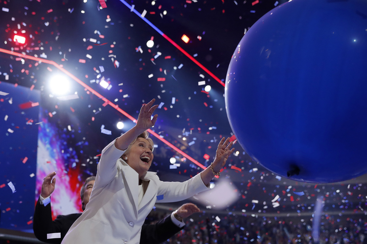 Hillary Clinton plays with balloons during a celebration on stage during the final day of the Democratic National Convention. (AP Photo/Carolyn Kaster)</p>