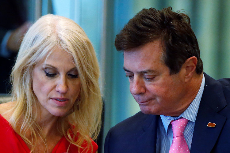 Newly-installed campaign manager Kellyanne Conway confers with the demoted and marginalized Paul Manafort at Trump Tower yesterday. (Carlo Allegri/Reuters)</p>  