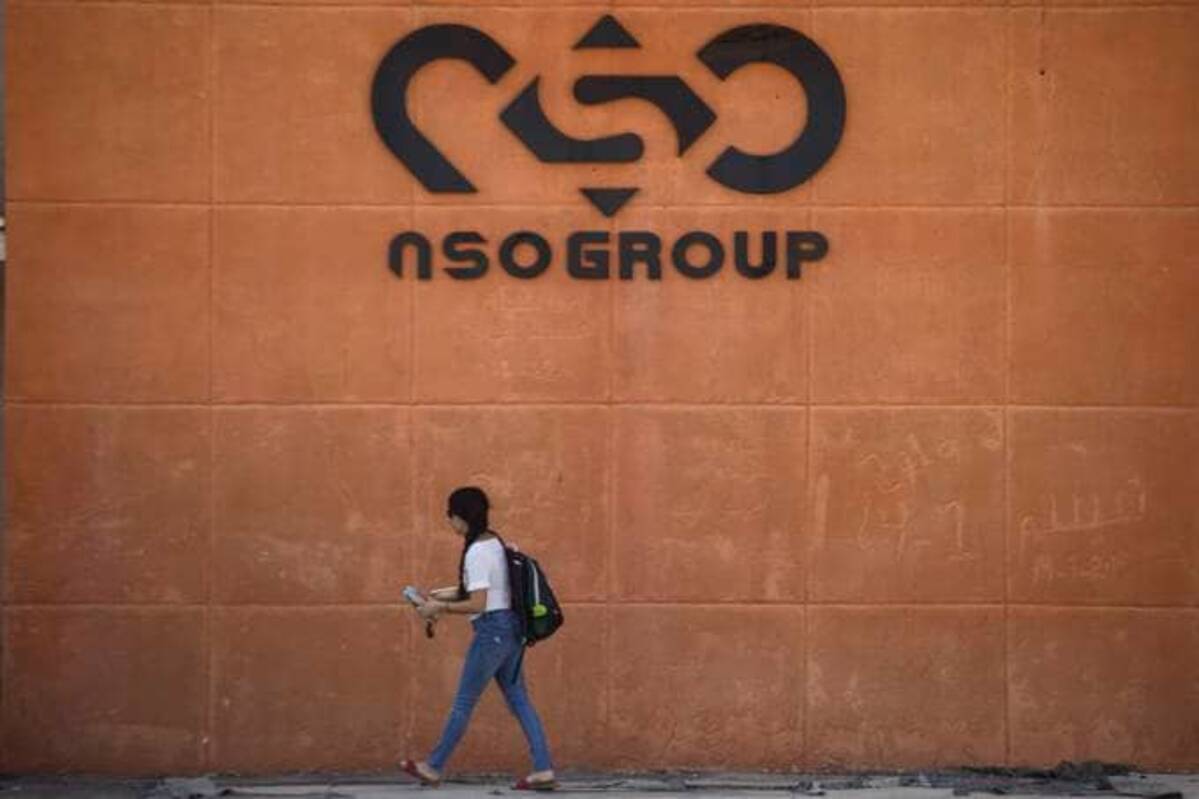 &nbsp;A woman walks by the building entrance of Israeli cyber company NSO Group. (Amir Levy/Getty Images)
