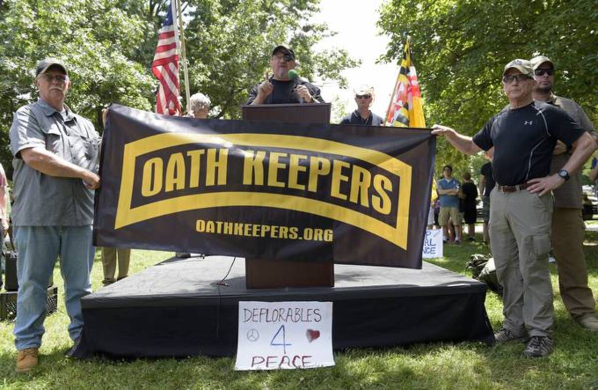 Stewart Rhodes, founder of the Oath Keepers, a citizen militia group, center, speaks during a rally outside the White House in Washington, on June 25, 2017. (Susan Walsh/AP)