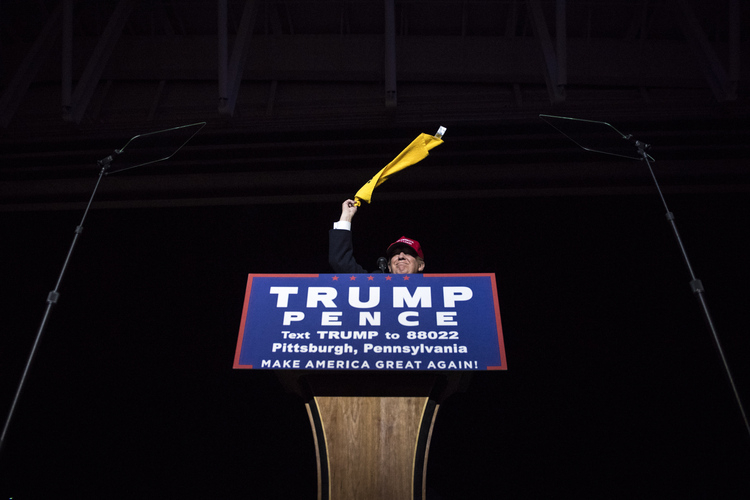 Trump waves a Terrible Towel in Moon Township, Pa., on Sunday. (Jabin Botsford/The Washington Post)</p>  