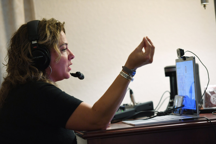 KrisAnne Hall works on her radio program from her room hotel at the AmericInn and Suites in Mounds View, Minnesota. (Matt McClain/ The Washington Post)</p>  