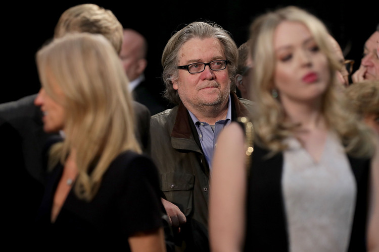 Trump campaign CEO Steve Bannon listens to Donald speak, with members of the family, at the final rally in Grand Rapids, Michigan. (Chip Somodevilla/Getty Images)</p>  