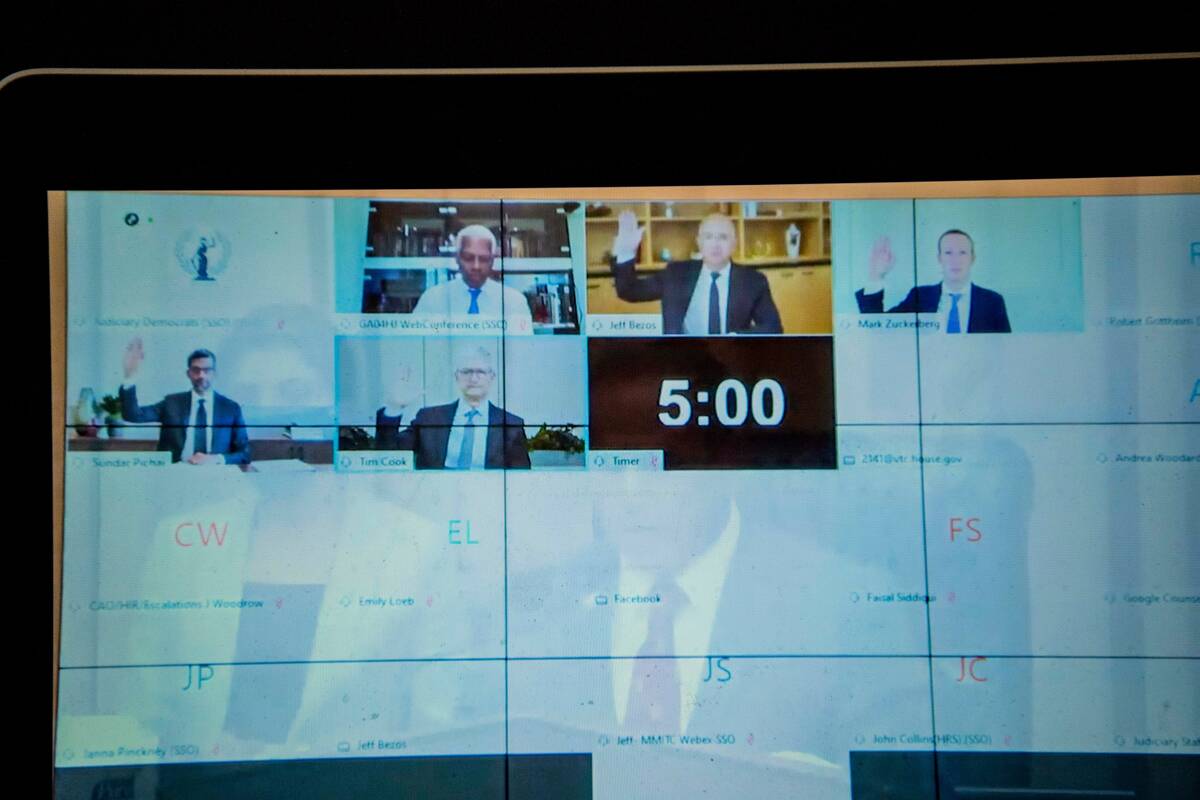 Jeff Bezos of Amazon, Tim Cook of Apple, Mark Zuckerberg of Facebook and Sundar Pichai of Google are sworn in before a House hearing on July 29, 2020, as seen via YouTube on a laptop. (Carolyn Van Houten/The Washington Post)