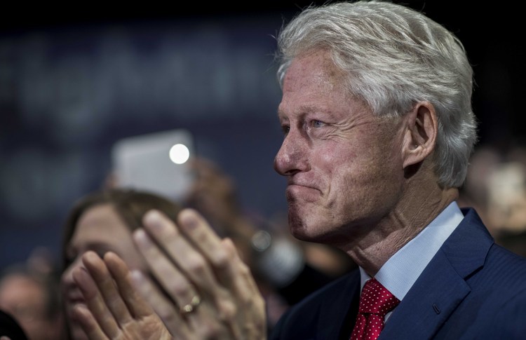 Bill Clinton proudly watches his wife speak.&nbsp;(Photo by Melina Mara/The Washington Post)</p>  