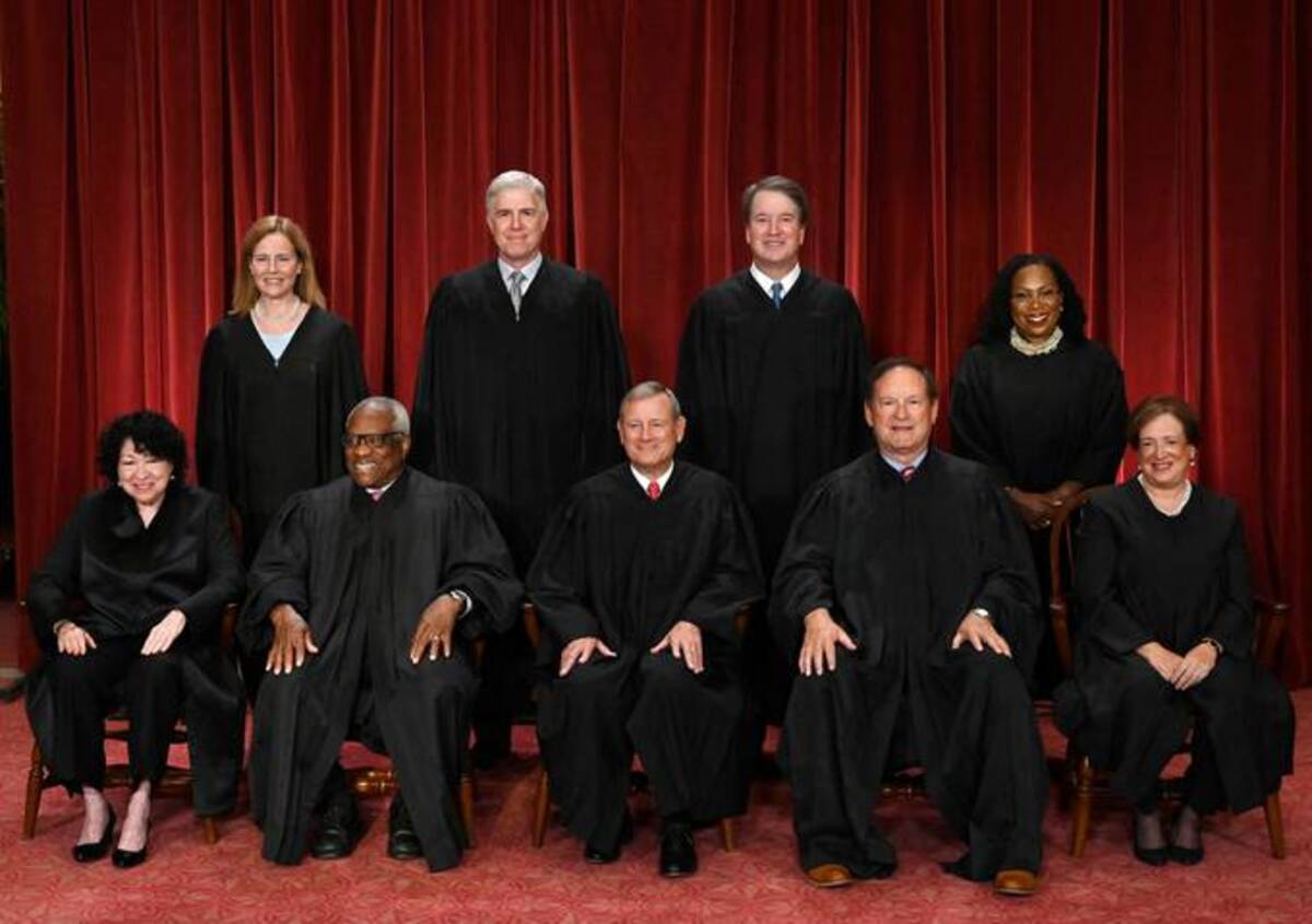 The official formal group photograph of the current U.S. Supreme Court, taken on Oct. 7. (Photo by OLIVIER DOULIERY / AFP)