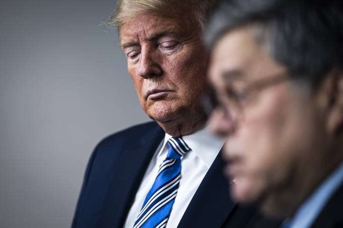 Attorney General William P. Barr appears with President Donald Trump during a coronavirus task force briefing in March 2020. (Jabin Botsford/The Washington Post)