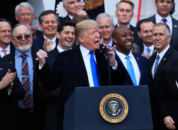 President Trump celebrates the passage of the Republican tax-cut bill at the White House on Dec. 20. (Manuel Balce Ceneta/Associated Press)</p>