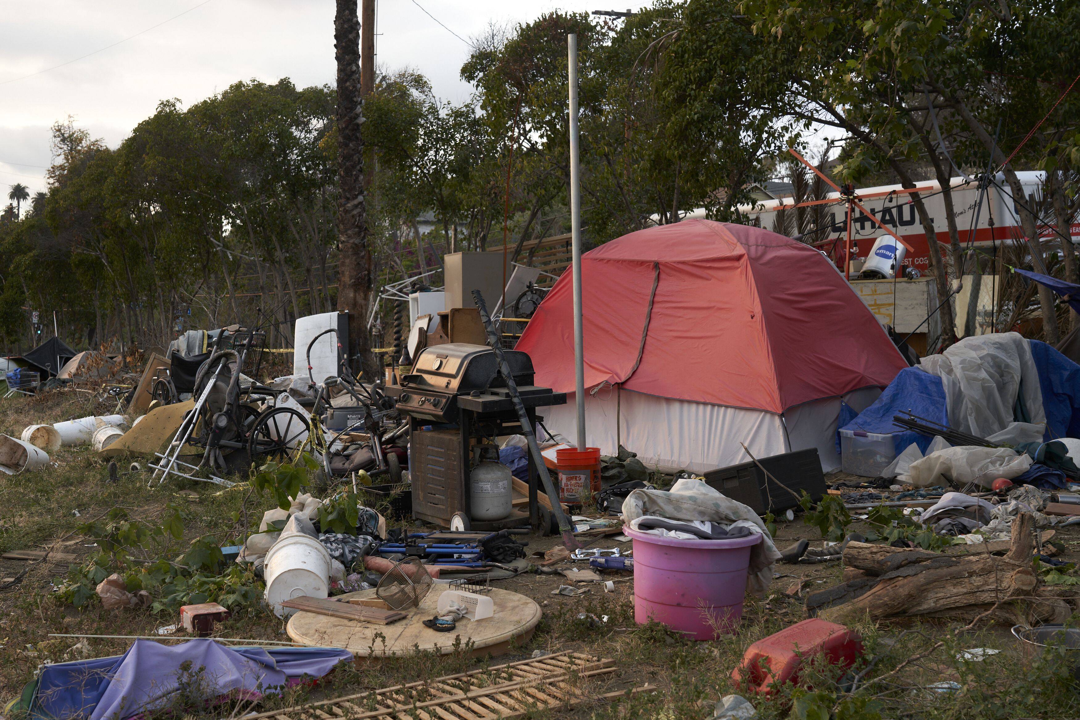 A homeless encampment along U.S. Highway 101 in the Echo Park neighborhood of Los Angeles on May 15, 2021. (Photo by Philip Cheung for The Washington Post)