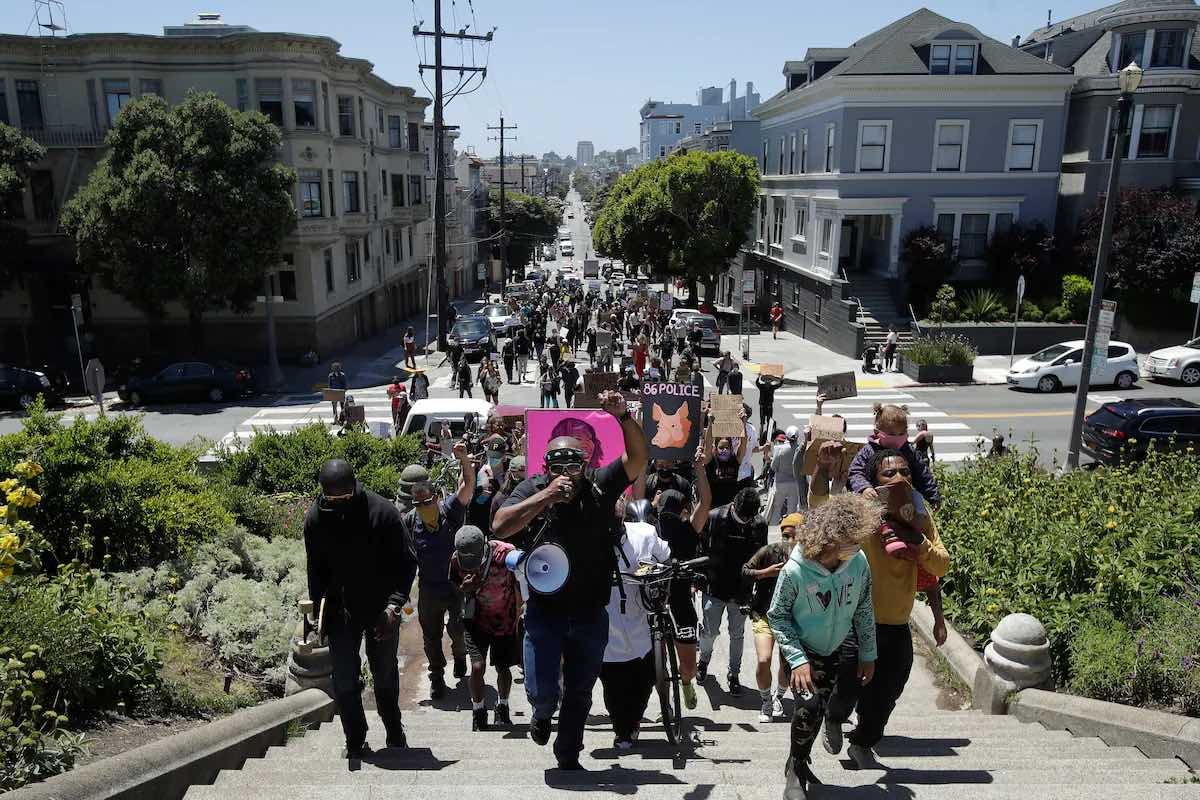 Jason Jamerson of Bay Area Hospitality for Black Lives, bottom center, leads a march in San Francisco on June 30, 2020, during a protest calling for an end to racial injustice and accountability for police. (Jeff Chiu/AP)