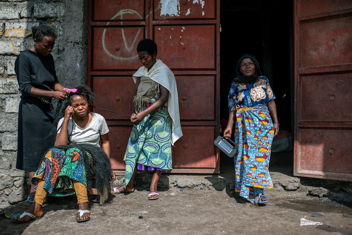 Furaha Anociata, 51, stands outside a church in Goma where she is staying with her family after fleeing violence in their village. (Arlette Bashizi for The Washington Post)