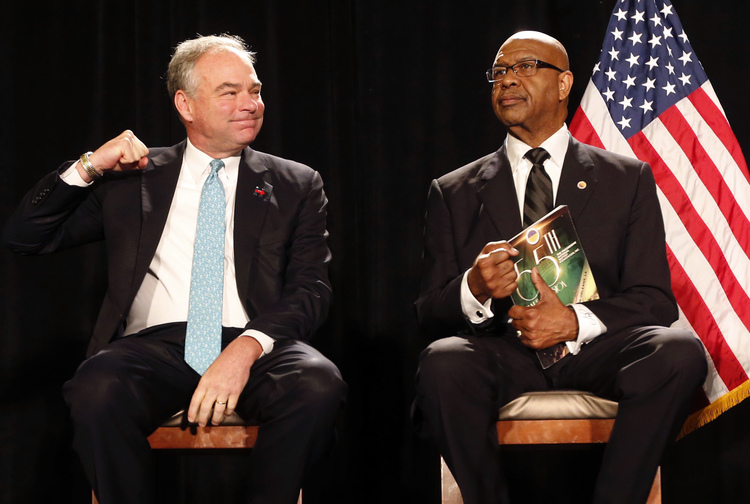 Tim Kaine&nbsp;reacts to the crowd singing hymns&nbsp;while waiting with Rev. Dr. James Perkins&nbsp;before speaking&nbsp;in New Orleans.&nbsp;(Gerald Herbert/AP)</p>  