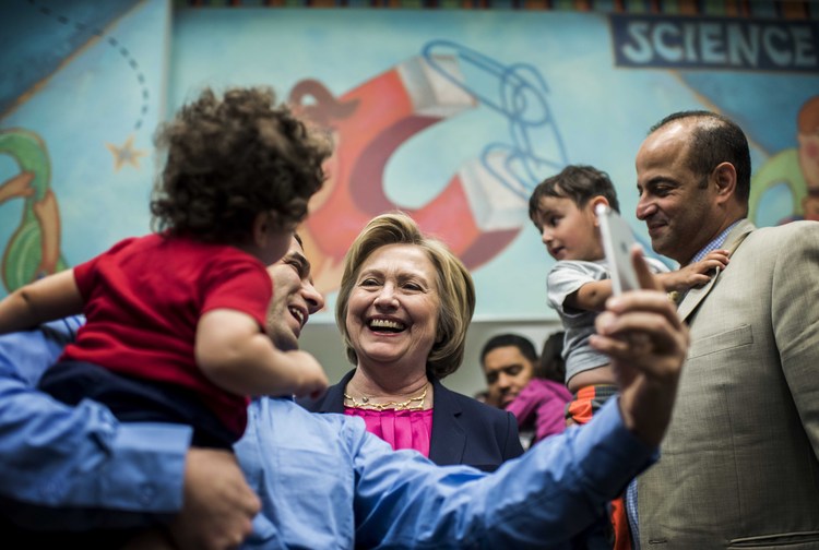 Clinton visits an&nbsp;early childhood facility&nbsp;in Fairfax yesterday. (Melina Mara/The Washington Post)</p>  