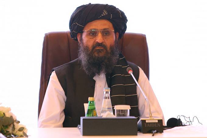 In this July photo, the leader of the Taliban negotiating team Mullah Abdul Ghani Baradar looks on the final declaration of the peace talks between the Afghan government and the Taliban is presented in Qatar's capital Doha. (Photo by KARIM JAAFAR / AFP) (Photo by KARIM JAAFAR/AFP via Getty Images)