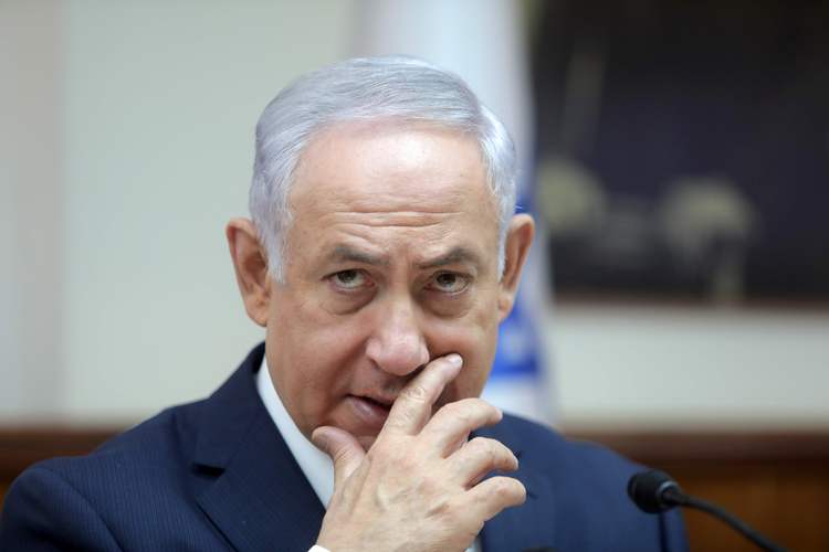 Israeli Prime Minister Benjamin Netanyahu leads his weekly cabinet meeting in his office in Jerusalem on Sunday. (Dan Balilty/AFP/Getty Images)  