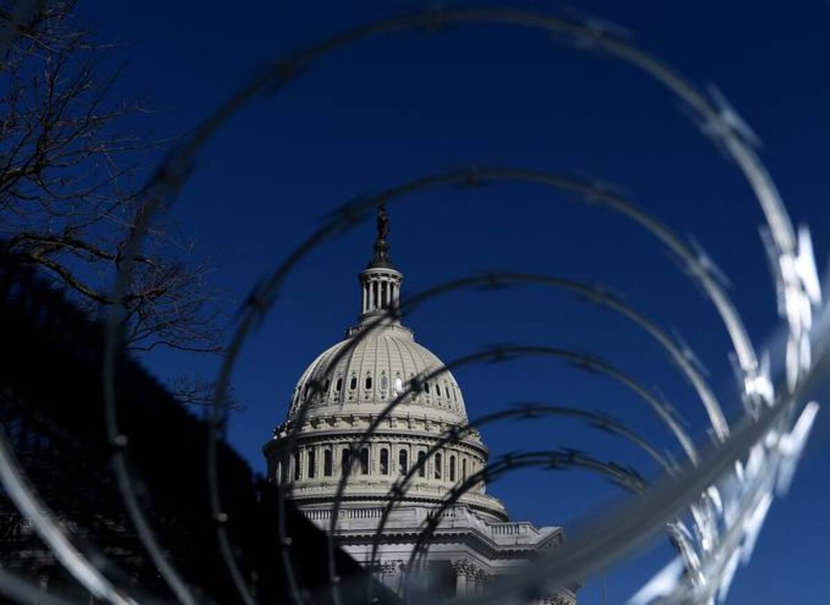 Security fencing surrounds the U.S. Capitol on March 5 in Washington. (Olivier Douliery/AFP)